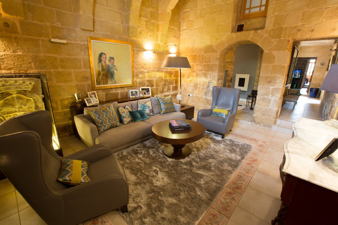 Restored Maltese stone interior with a contemporary sitting area designed by LDesigns